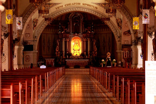 a view of a church from the back of the pews