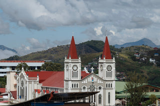 a large white church with red steeples on top of it