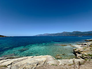 A view of the ocean from a rocky shore