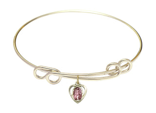 8 1/2 inch Round Double Loop Hamilton Gold Bangle Bracelet with a 14kt Gold Filled Miraculous charm.