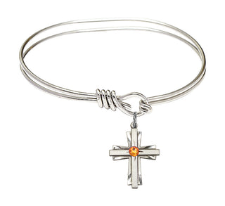 5 3/4 inch Oval Eye Hook Rhodium Bangle Bracelet with a Sterling Silver Cross charm.