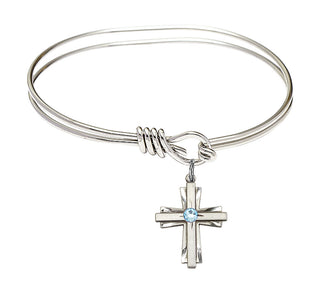 5 3/4 inch Oval Eye Hook Rhodium Bangle Bracelet with a Sterling Silver Cross charm.