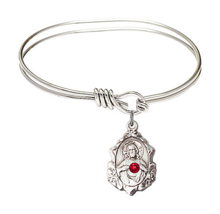 5 3/4 inch Oval Eye Hook Rhodium Bangle Bracelet with a Sterling Silver Scapular charm.