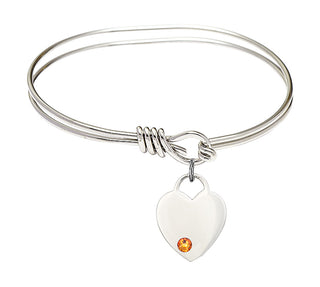 5 3/4 inch Oval Eye Hook Rhodium Bangle Bracelet with a Sterling Silver Heart charm. Engraved Catholic Saint Jewelry