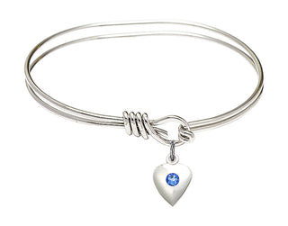 5 3/4 inch Oval Eye Hook Rhodium Bangle Bracelet with a Sterling Silver Heart charm.