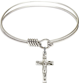 Bangle Bracelet with a Crucifix charm.