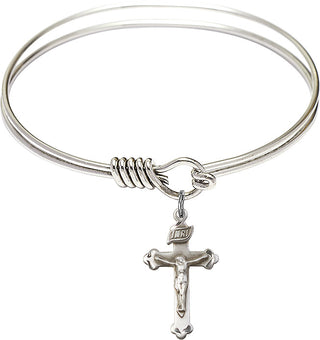 Bangle Bracelet with a Crucifix charm.