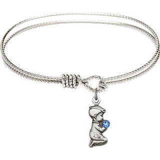 6 1/4 inch Oval Eye Hook Rhodium Bangle Bracelet with a Sterling Silver Praying Boy charm.