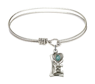 6 1/4 inch Oval Eye Hook Rhodium Bangle Bracelet with a Sterling Silver Miraculous charm.