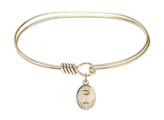 7 inch Oval Eye Hook Hamilton Gold Bangle Bracelet with a 14kt Gold Filled Holy Communion charm.