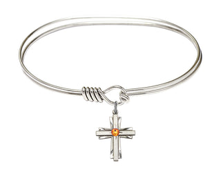 7 inch Oval Eye Hook Rhodium Bangle Bracelet with a Sterling Silver Cross charm.