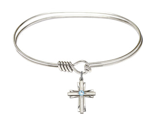 7 inch Oval Eye Hook Rhodium Bangle Bracelet with a Sterling Silver Cross charm.