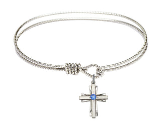 7 1/4 inch Oval Eye Hook Rhodium Bangle Bracelet with a Sterling Silver Cross charm.