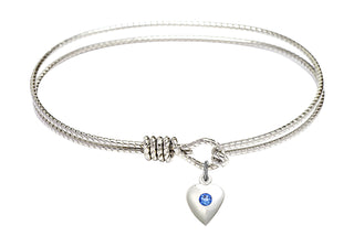 7 1/4 inch Oval Eye Hook Rhodium Bangle Bracelet with a Sterling Silver Heart charm.