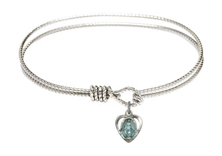 7 1/4 inch Oval Eye Hook Rhodium Bangle Bracelet with a Sterling Silver Miraculous Heart charm.