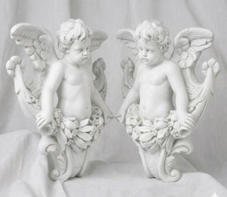 Matched pair of gliding angel statues, one facing left and one facing right, in fiberglass resin. — detail view