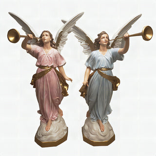 Two large hand-painted angel statues each holding a trumpet, standing side by side.