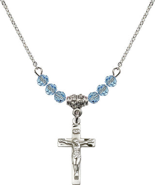 18" Rhodium Plated Necklace with 4mm Aqua Crystal Beads featuring a Sterling Silver Crucifix Medal.