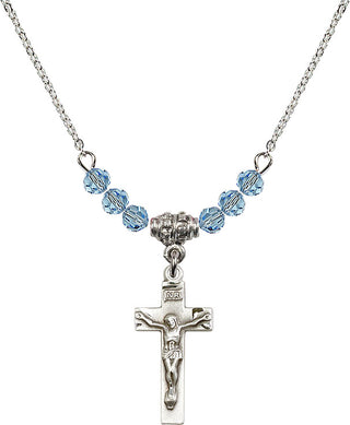 18" Rhodium Plated Necklace with 4mm Aqua Crystal Beads featuring a Sterling Silver Crucifix Medal.