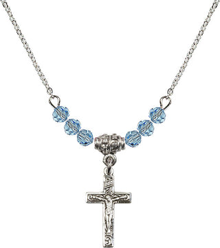 18" Rhodium Plated Necklace with 4mm Aqua Crystal Beads featuring a Sterling Silver Crucifix Medal.