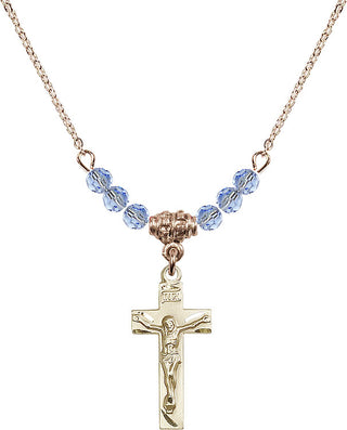 18" Hamilton Gold Plated Necklace with 4mm Light Sapphire Crystal Beads featuring a 14kt Gold Filled Crucifix Medal.