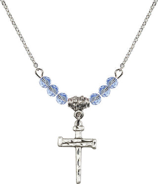 18" Rhodium Plated Necklace with 4mm Light Sapphire Crystal Beads featuring a Sterling Silver Nail Cross Medal.