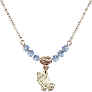 18" Hamilton Gold Plated Necklace with 4mm Light Sapphire Crystal Beads featuring a 14kt Gold Filled Praying Hands Medal.