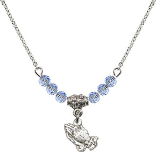 18" Rhodium Plated Necklace with 4mm Light Sapphire Crystal Beads featuring a Sterling Silver Praying Hands Medal.