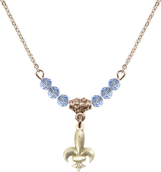 18" Hamilton Gold Plated Necklace with 4mm Light Sapphire Crystal Beads featuring a 14kt Gold Filled Fleur de Lis Medal.