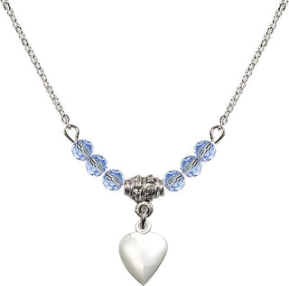 18" Rhodium Plated Necklace with 4mm Light Sapphire Crystal Beads featuring a Sterling Silver Heart Medal.