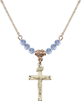 18" Hamilton Gold Plated Necklace with 4mm Light Sapphire Crystal Beads featuring a 14kt Gold Filled Crucifix Medal.