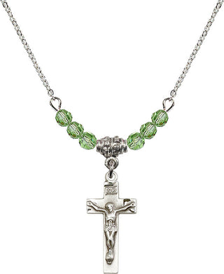 18" Rhodium Plated Necklace with 4mm Peridot Crystal Beads featuring a Sterling Silver Crucifix Medal.