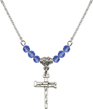 18" Rhodium Plated Necklace with 4mm Sapphire Crystal Beads featuring a Sterling Silver Nail Cross Medal.