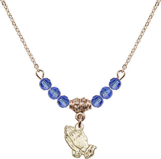 18" Hamilton Gold Plated Necklace with 4mm Sapphire Crystal Beads featuring a 14kt Gold Filled Praying Hands Medal.