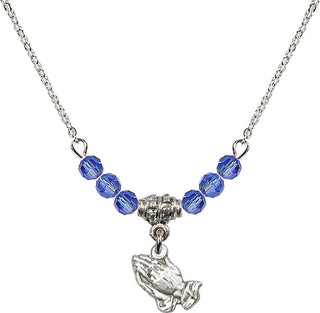 18" Rhodium Plated Necklace with 4mm Sapphire Crystal Beads featuring a Sterling Silver Praying Hands Medal.