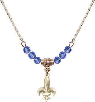 18" Hamilton Gold Plated Necklace with 4mm Sapphire Crystal Beads featuring a 14kt Gold Filled Fleur de Lis Medal.