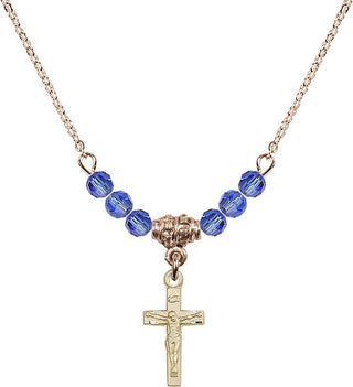 18" Hamilton Gold Plated Necklace with 4mm Sapphire Crystal Beads featuring a 14kt Gold Filled Crucifix Medal.