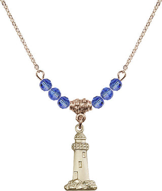 18" Hamilton Gold Plated Necklace with 4mm Sapphire Crystal Beads featuring a 14kt Gold Filled Lighthouse Medal.