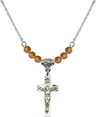 18" Rhodium Plated Necklace with 4mm Topaz Crystal Beads featuring a Sterling Silver Crucifix Medal.