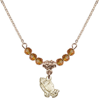 18" Hamilton Gold Plated Necklace with 4mm Topaz Crystal Beads featuring a 14kt Gold Filled Praying Hands Medal.