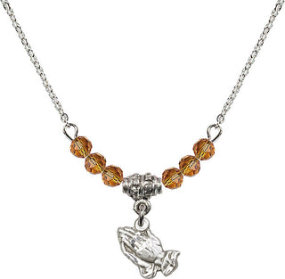 18" Rhodium Plated Necklace with 4mm Topaz Crystal Beads featuring a Sterling Silver Praying Hands Medal.