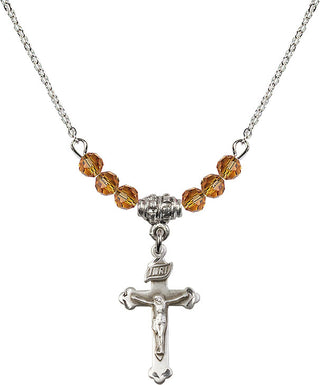 18" Rhodium Plated Necklace with 4mm Topaz Crystal Beads featuring a Sterling Silver Crucifix Medal.