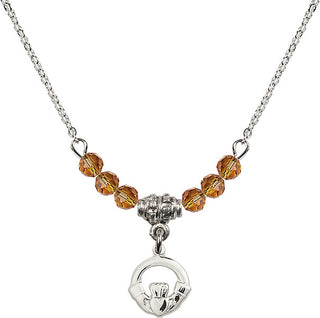 18" Rhodium Plated Necklace with 4mm Topaz Crystal Beads featuring a Sterling Silver Claddagh Medal.