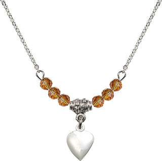 18" Rhodium Plated Necklace with 4mm Topaz Crystal Beads featuring a Sterling Silver Heart Medal.