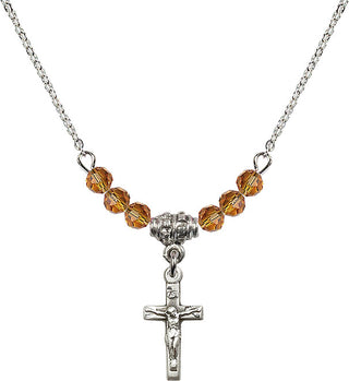 18" Rhodium Plated Necklace with 4mm Topaz Crystal Beads featuring a Sterling Silver Crucifix Medal.