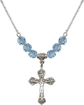 18" Rhodium Plated Necklace with 4mm Aqua Crystal Beads featuring a Sterling Silver Crucifix Medal.