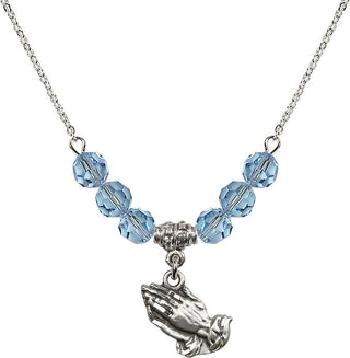 18" Rhodium Plated Necklace with 4mm Aqua Crystal Beads featuring a Sterling Silver Praying Hands Medal.