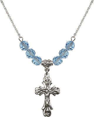 18" Rhodium Plated Necklace with 4mm Aqua Crystal Beads featuring a Sterling Silver Crucifix Medal.