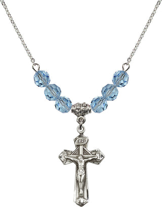 18" Rhodium Plated Necklace with 4mm Aqua Crystal Beads featuring a Sterling Silver Crucifix Medal.