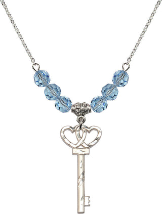 18" Rhodium Plated Necklace with 4mm Aqua Crystal Beads featuring a Sterling Silver Small Key w/Double Hearts Medal.